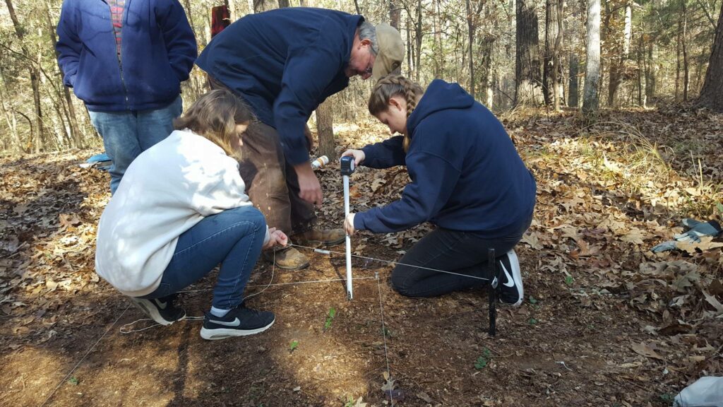 Four Archaeologist measuring