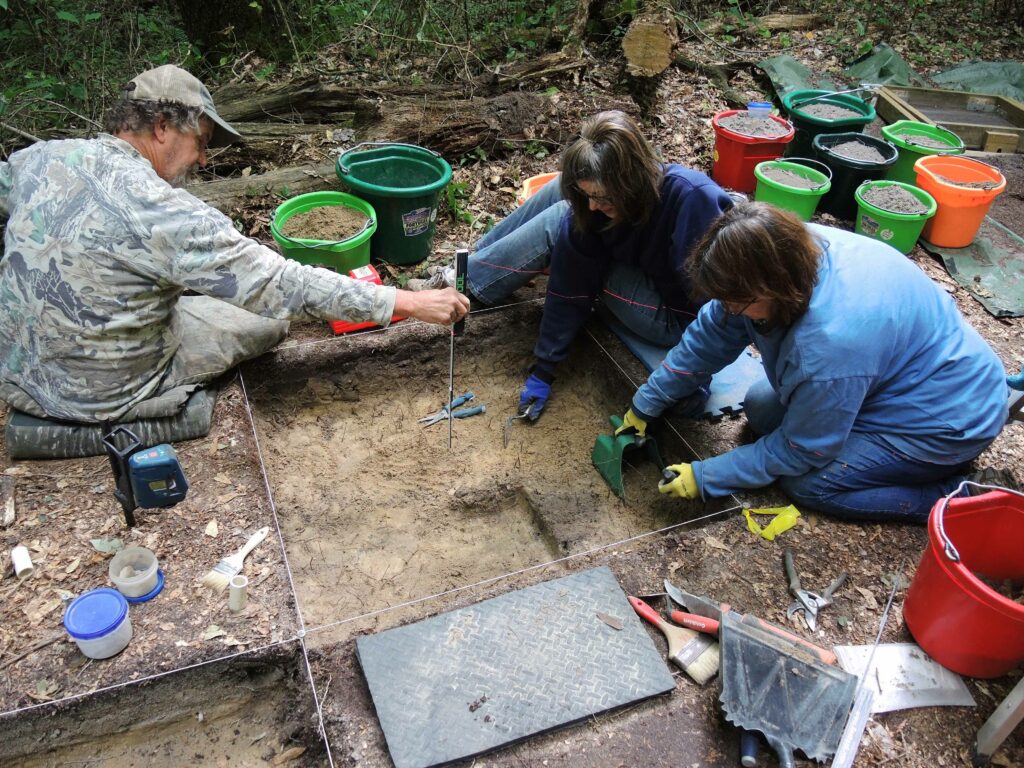 three archeologist doing some research
